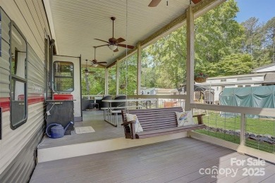 Welcome to your perfect getaway in Twin Harbor on Lake Tillery on The Tillery Tradition Country Club in North Carolina - for sale on GolfHomes.com, golf home, golf lot