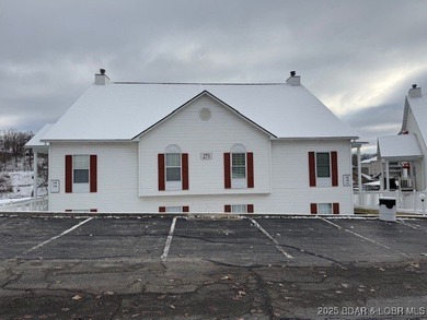 Charming Lakefront Condo in a Small, Sought-After Community! on Seasons Ridge At Four Seasons in Missouri - for sale on GolfHomes.com, golf home, golf lot