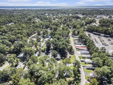 Welcome to your new oasis in the desirable Windjammer Village on Indian Wells Golf Course in South Carolina - for sale on GolfHomes.com, golf home, golf lot