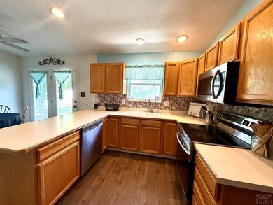 Come see this 4-level home, ideally situated in a desirable GOLF on Desert Hawk At Pueblo West in Colorado - for sale on GolfHomes.com, golf home, golf lot