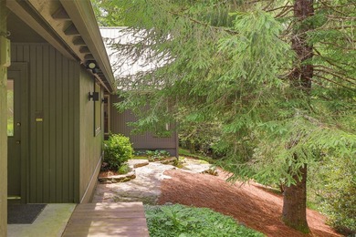 Discover this Holly Forest home in a one-of-a-kind setting on Sapphire National Golf Club in North Carolina - for sale on GolfHomes.com, golf home, golf lot
