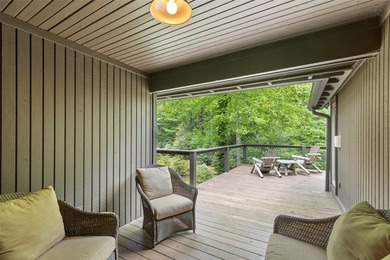 Discover this Holly Forest home in a one-of-a-kind setting on Sapphire National Golf Club in North Carolina - for sale on GolfHomes.com, golf home, golf lot