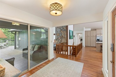 Discover this Holly Forest home in a one-of-a-kind setting on Sapphire National Golf Club in North Carolina - for sale on GolfHomes.com, golf home, golf lot