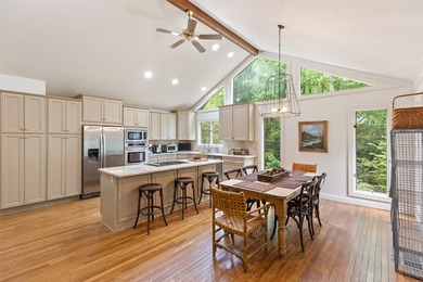 Discover this Holly Forest home in a one-of-a-kind setting on Sapphire National Golf Club in North Carolina - for sale on GolfHomes.com, golf home, golf lot