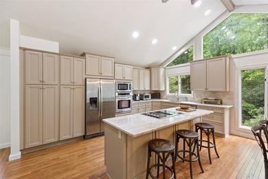 Discover this Holly Forest home in a one-of-a-kind setting on Sapphire National Golf Club in North Carolina - for sale on GolfHomes.com, golf home, golf lot