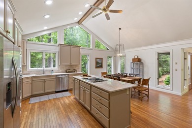 Discover this Holly Forest home in a one-of-a-kind setting on Sapphire National Golf Club in North Carolina - for sale on GolfHomes.com, golf home, golf lot