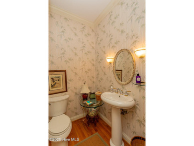 Welcome to this elegant, all-brick custom home built by on Pinewild Country Club of Pinehurst in North Carolina - for sale on GolfHomes.com, golf home, golf lot