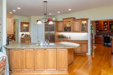 Welcome to this elegant, all-brick custom home built by on Pinewild Country Club of Pinehurst in North Carolina - for sale on GolfHomes.com, golf home, golf lot