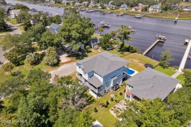 Experience luxury coastal living at its finest on Oak Island's on Founders Club At St. James Plantation in North Carolina - for sale on GolfHomes.com, golf home, golf lot