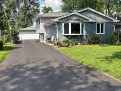 Tucked away on a peaceful, tree-lined street in coveted North on Downers Grove Golf Club in Illinois - for sale on GolfHomes.com, golf home, golf lot