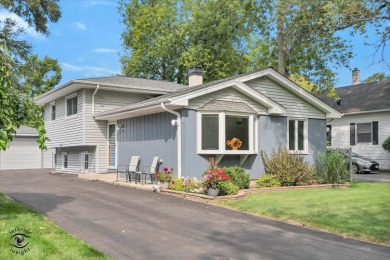 Tucked away on a peaceful, tree-lined street in coveted North on Downers Grove Golf Club in Illinois - for sale on GolfHomes.com, golf home, golf lot