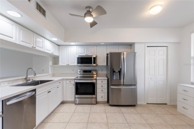 Welcome to this  beautifully maintained 2-bedroom, 2-bath on East Bay Golf Club in Florida - for sale on GolfHomes.com, golf home, golf lot