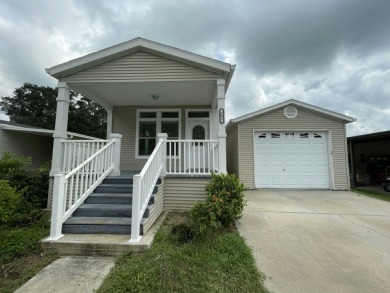 Discover your ideal Florida retreat in this well-maintained 1 on Golden Lakes Golf Course in Florida - for sale on GolfHomes.com, golf home, golf lot