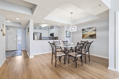 Step into the open-plan living space where light floods in on Barefoot Resort and Golf Club  in South Carolina - for sale on GolfHomes.com, golf home, golf lot