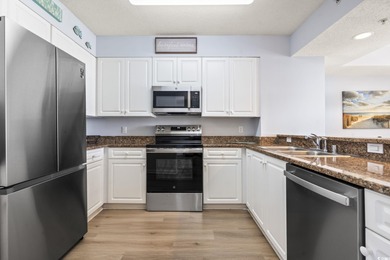 Step into the open-plan living space where light floods in on Barefoot Resort and Golf Club  in South Carolina - for sale on GolfHomes.com, golf home, golf lot