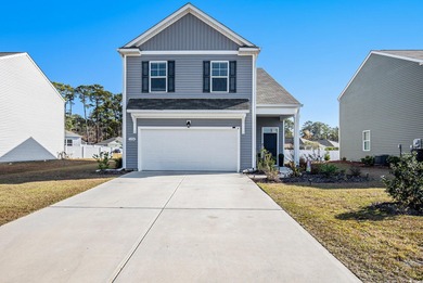 Welcome to this stunning 5-bedroom, 3.5-bath home in the Island on Island Green Golf Club in South Carolina - for sale on GolfHomes.com, golf home, golf lot