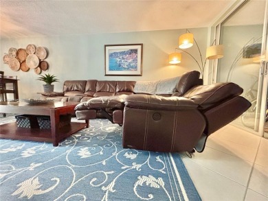 Welcome home to this warm and inviting, FULLY FURNISHED TURNKEY on Palm-Aire Country Club and Resort - Palms in Florida - for sale on GolfHomes.com, golf home, golf lot