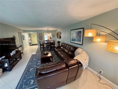 Welcome home to this warm and inviting, FULLY FURNISHED TURNKEY on Palm-Aire Country Club and Resort - Palms in Florida - for sale on GolfHomes.com, golf home, golf lot