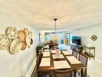 Welcome home to this warm and inviting, FULLY FURNISHED TURNKEY on Palm-Aire Country Club and Resort - Palms in Florida - for sale on GolfHomes.com, golf home, golf lot