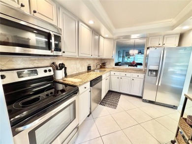 Welcome home to this warm and inviting, FULLY FURNISHED TURNKEY on Palm-Aire Country Club and Resort - Palms in Florida - for sale on GolfHomes.com, golf home, golf lot