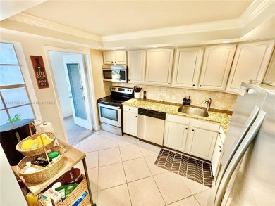 Welcome home to this warm and inviting, FULLY FURNISHED TURNKEY on Palm-Aire Country Club and Resort - Palms in Florida - for sale on GolfHomes.com, golf home, golf lot