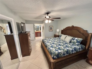 Welcome home to this warm and inviting, FULLY FURNISHED TURNKEY on Palm-Aire Country Club and Resort - Palms in Florida - for sale on GolfHomes.com, golf home, golf lot