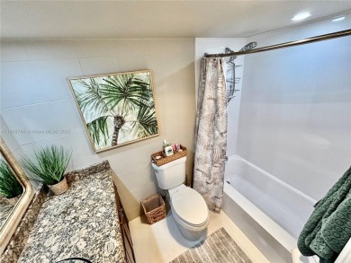 Welcome home to this warm and inviting, FULLY FURNISHED TURNKEY on Palm-Aire Country Club and Resort - Palms in Florida - for sale on GolfHomes.com, golf home, golf lot