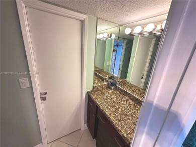 Welcome home to this warm and inviting, FULLY FURNISHED TURNKEY on Palm-Aire Country Club and Resort - Palms in Florida - for sale on GolfHomes.com, golf home, golf lot