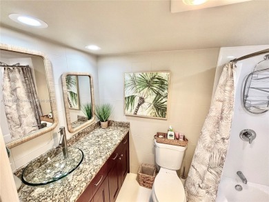 Welcome home to this warm and inviting, FULLY FURNISHED TURNKEY on Palm-Aire Country Club and Resort - Palms in Florida - for sale on GolfHomes.com, golf home, golf lot