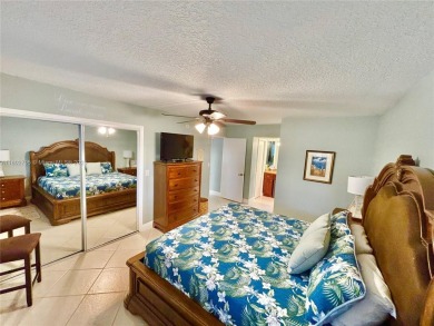 Welcome home to this warm and inviting, FULLY FURNISHED TURNKEY on Palm-Aire Country Club and Resort - Palms in Florida - for sale on GolfHomes.com, golf home, golf lot