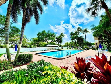 Welcome home to this warm and inviting, FULLY FURNISHED TURNKEY on Palm-Aire Country Club and Resort - Palms in Florida - for sale on GolfHomes.com, golf home, golf lot