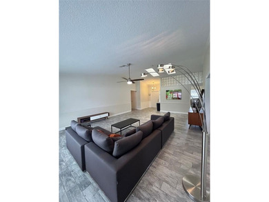 Discover this stunning, fully renovated home in Boca Raton on Boca Lago Golf and Country Club in Florida - for sale on GolfHomes.com, golf home, golf lot