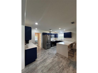 Discover this stunning, fully renovated home in Boca Raton on Boca Lago Golf and Country Club in Florida - for sale on GolfHomes.com, golf home, golf lot