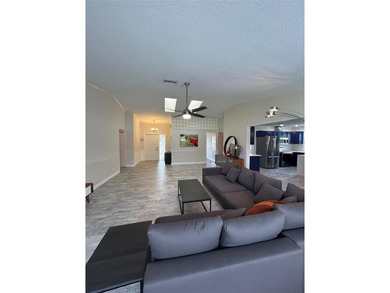 Discover this stunning, fully renovated home in Boca Raton on Boca Lago Golf and Country Club in Florida - for sale on GolfHomes.com, golf home, golf lot