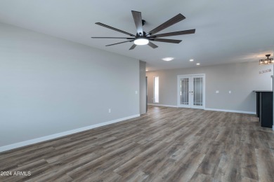 Discover this beautifully remodeled Sun City home in a thriving on Sun City Lakes West and East in Arizona - for sale on GolfHomes.com, golf home, golf lot