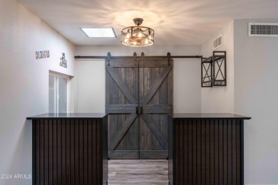 Discover this beautifully remodeled Sun City home in a thriving on Sun City Lakes West and East in Arizona - for sale on GolfHomes.com, golf home, golf lot