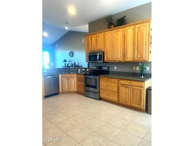 This custom home by Roark Construction is a 3 Bedroom, 2 Bath on Coyote Lakes Golf Club in Arizona - for sale on GolfHomes.com, golf home, golf lot