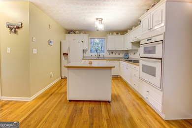 Peace & tranquility while living the lake life! Enjoy the perks on Turtle Cove Golf Course in Georgia - for sale on GolfHomes.com, golf home, golf lot