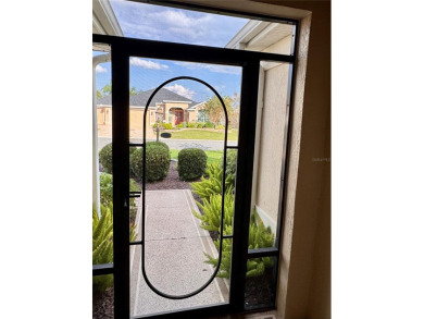 This beautifully maintained and move-in ready Iris Designer home on The Links of Spruce Creek in Florida - for sale on GolfHomes.com, golf home, golf lot