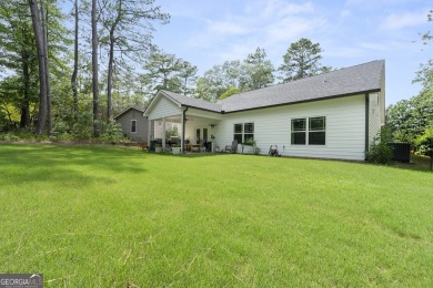 This lovely custom-built home offers a flowing, spacious on Fairfield Plantation Golf and Country Club in Georgia - for sale on GolfHomes.com, golf home, golf lot