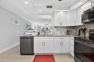 EXQUISITE 1ST FL DELUXE MODEL IN SOUGHT AFTER ARUBA VILLAGE ON on Wynmoor Golf Course in Florida - for sale on GolfHomes.com, golf home, golf lot