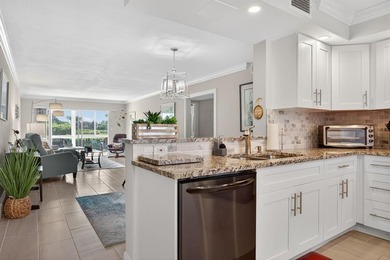 EXQUISITE 1ST FL DELUXE MODEL IN SOUGHT AFTER ARUBA VILLAGE ON on Wynmoor Golf Course in Florida - for sale on GolfHomes.com, golf home, golf lot