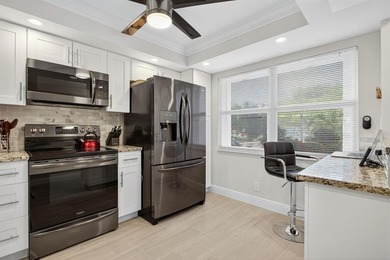 EXQUISITE 1ST FL DELUXE MODEL IN SOUGHT AFTER ARUBA VILLAGE ON on Wynmoor Golf Course in Florida - for sale on GolfHomes.com, golf home, golf lot