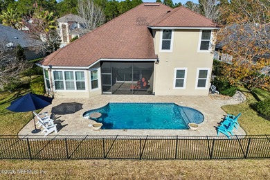 Stunning pool home with a pond to golf course view in gated on Magnolia Point Golf and Country Club in Florida - for sale on GolfHomes.com, golf home, golf lot