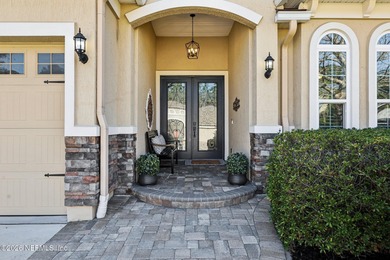 Stunning pool home with a pond to golf course view in gated on Magnolia Point Golf and Country Club in Florida - for sale on GolfHomes.com, golf home, golf lot