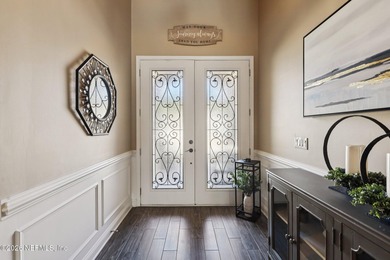 Stunning pool home with a pond to golf course view in gated on Magnolia Point Golf and Country Club in Florida - for sale on GolfHomes.com, golf home, golf lot