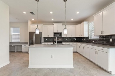 Welcome to 1423 Bunker Drive in Davenport, Florida. Situated on on The Oasis Club at Champions Gate in Florida - for sale on GolfHomes.com, golf home, golf lot