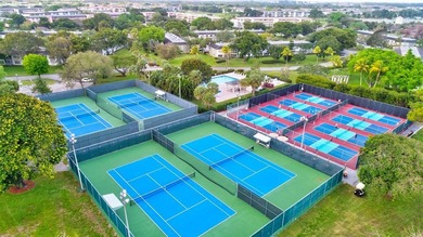 EXQUISITE 1ST FL DELUXE MODEL IN SOUGHT AFTER ARUBA VILLAGE ON on Wynmoor Golf Course in Florida - for sale on GolfHomes.com, golf home, golf lot