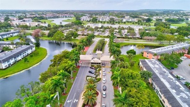 EXQUISITE 1ST FL DELUXE MODEL IN SOUGHT AFTER ARUBA VILLAGE ON on Wynmoor Golf Course in Florida - for sale on GolfHomes.com, golf home, golf lot