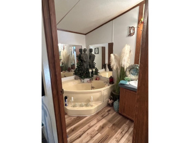 Nice and Open 3 bedroom 2 bath Manufactured home. Large backyard on Mountain Creek Golf Club in Texas - for sale on GolfHomes.com, golf home, golf lot